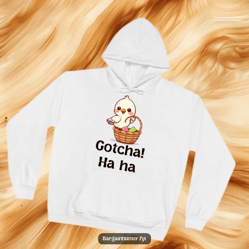Funny hoodie depicting a mischievous bird dropping an item into a basket with a cunning look.