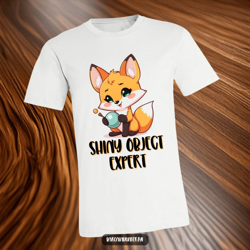 Funny Fox Treasure T-Shirt: A proud fox excitedly shows off a sparkling shiny object it just found, looking delighted.