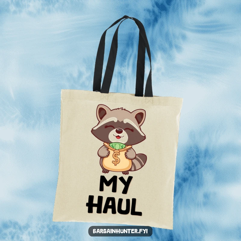 Funny Raccoon Tote Bag: A winking raccoon with a money bag, ready for errands, highlighting a funny, thrifty personality.